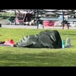 couple caught under a blanket in