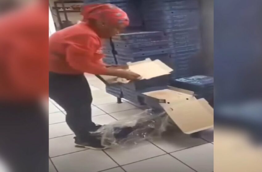  romans pizza video | woman dressed in romans pizza uniform reusing pizza boxes